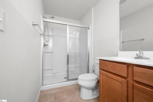 bathroom featuring toilet, a shower with shower door, and vanity