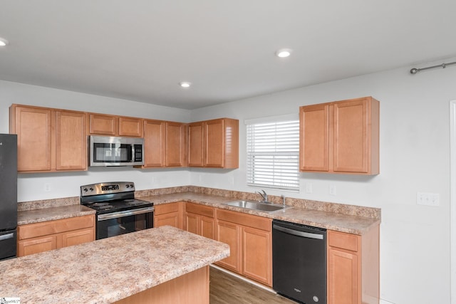 kitchen featuring dark wood-type flooring, sink, light brown cabinets, and black appliances