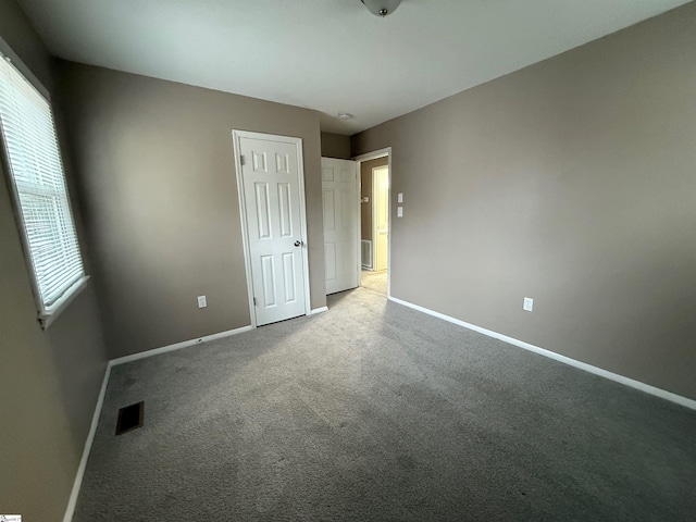 unfurnished bedroom with carpet