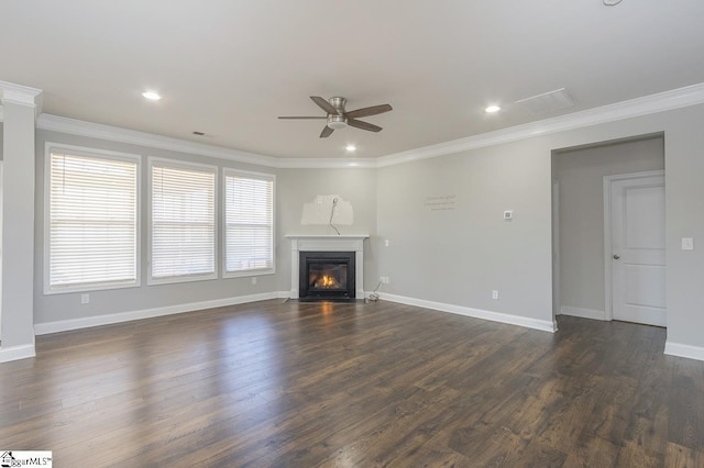 unfurnished living room featuring ceiling fan, dark wood-type flooring, and ornamental molding