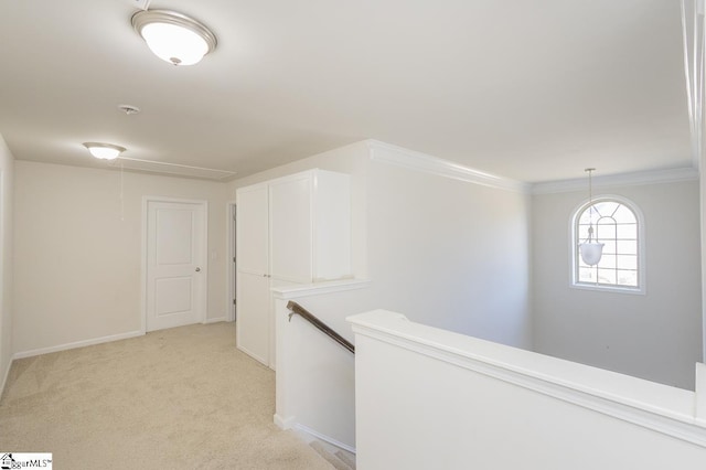 corridor featuring light colored carpet and ornamental molding