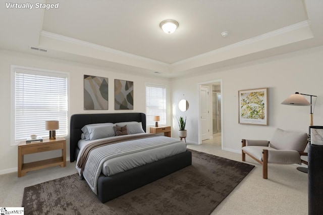 carpeted bedroom featuring crown molding, a raised ceiling, visible vents, and baseboards