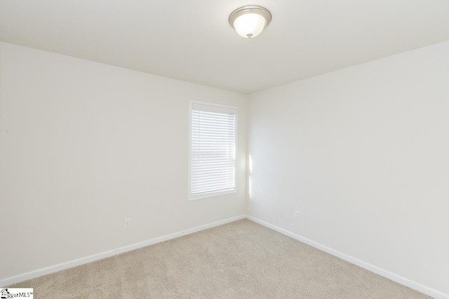 unfurnished room with light carpet