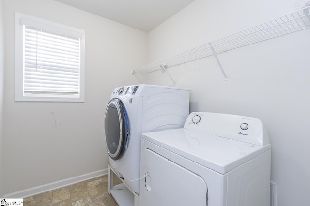 laundry room with separate washer and dryer