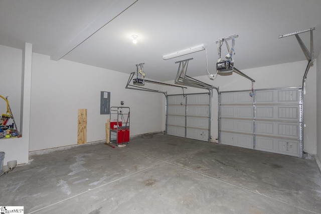 garage with electric panel and a garage door opener