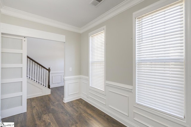 interior space with dark wood-type flooring and ornamental molding