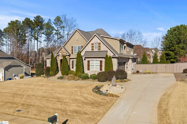 view of front of home with a garage and a front lawn