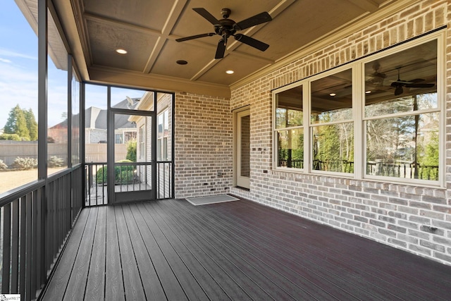 unfurnished sunroom with ceiling fan and coffered ceiling