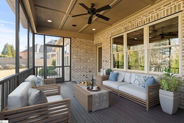 sunroom / solarium featuring ceiling fan and coffered ceiling