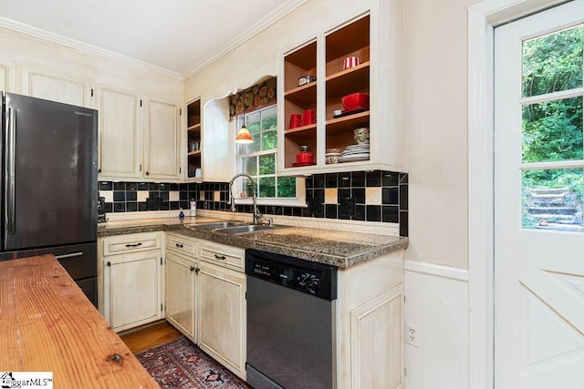 kitchen featuring dishwasher, wood counters, decorative backsplash, sink, and fridge