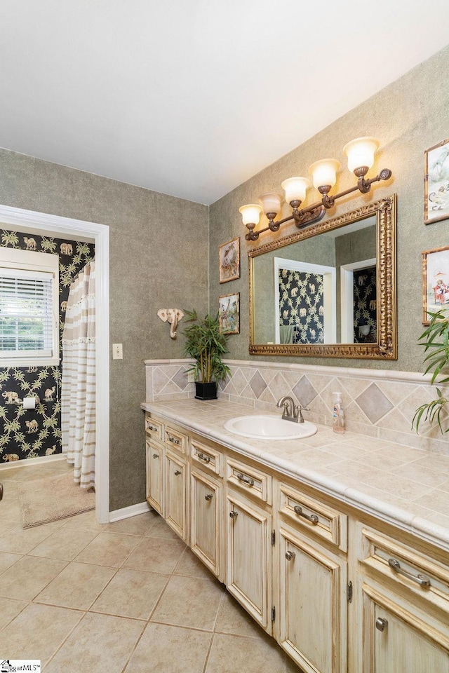 bathroom featuring tile patterned flooring and vanity