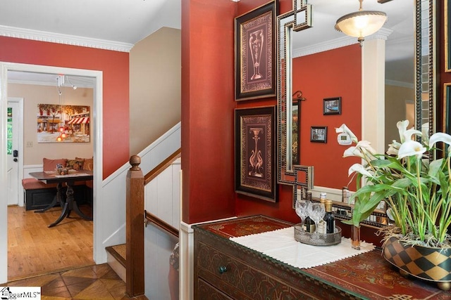 interior space featuring tile patterned floors, crown molding, and ornate columns