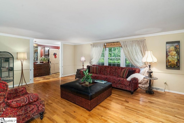 living room featuring wood-type flooring and ornamental molding