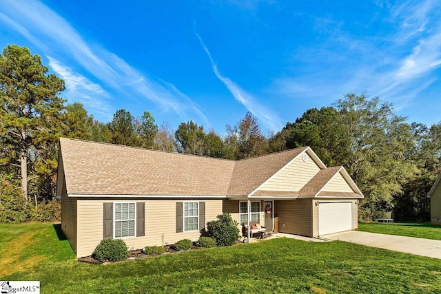 ranch-style house featuring a garage and a front yard