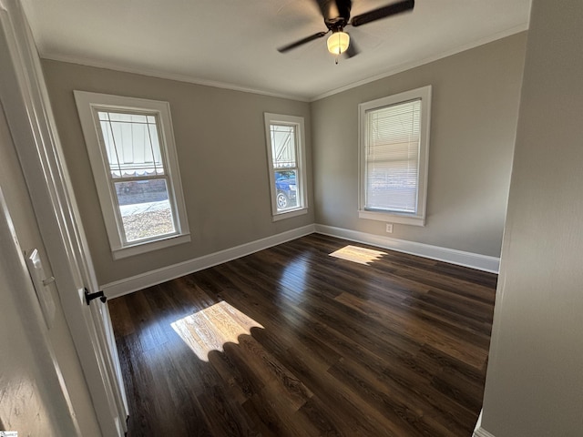 spare room with ceiling fan, dark hardwood / wood-style flooring, and ornamental molding