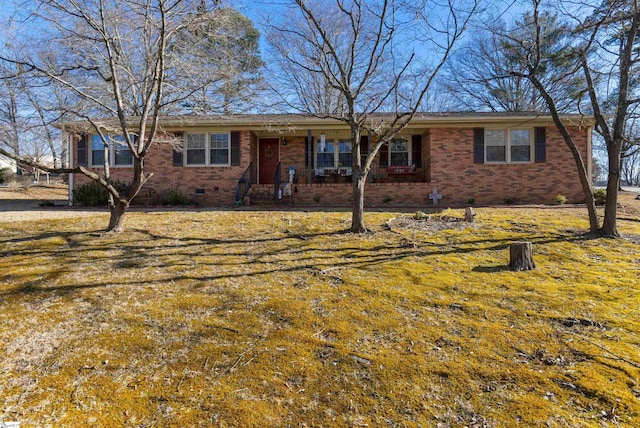 ranch-style home with a front lawn