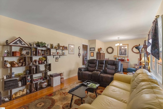 living room with hardwood / wood-style flooring and a chandelier