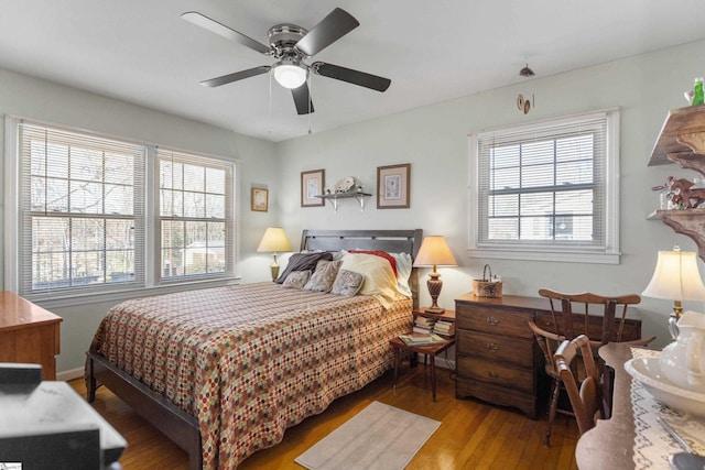 bedroom featuring ceiling fan and hardwood / wood-style flooring