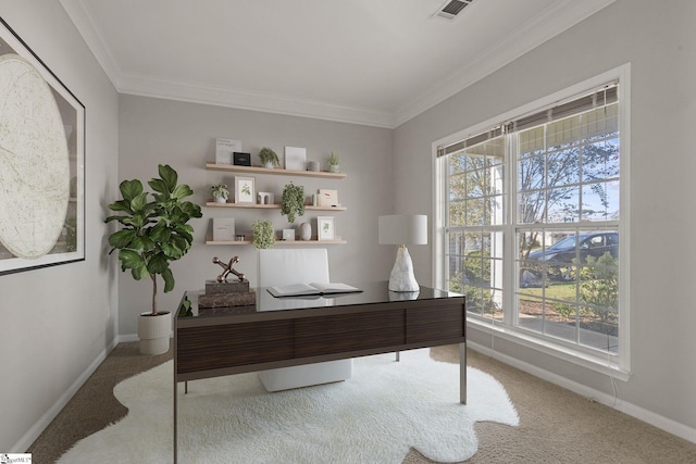 home office featuring carpet, a healthy amount of sunlight, and ornamental molding