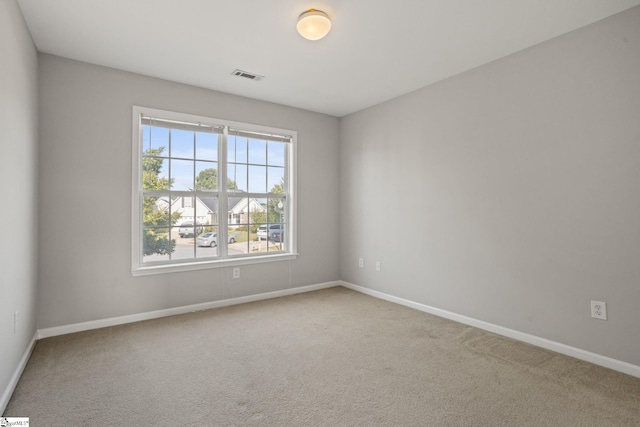 spare room featuring carpet floors