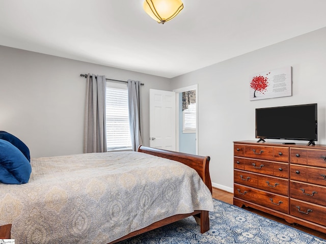 bedroom with hardwood / wood-style floors