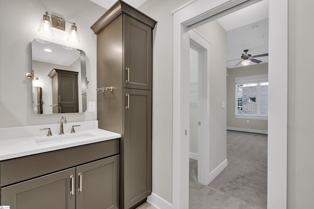 bathroom featuring ceiling fan and vanity