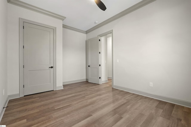 unfurnished bedroom with ceiling fan, light hardwood / wood-style floors, and ornamental molding