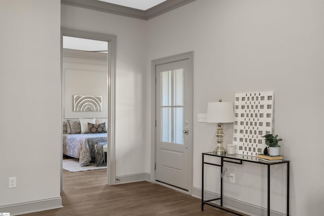 foyer entrance featuring hardwood / wood-style floors and ornamental molding