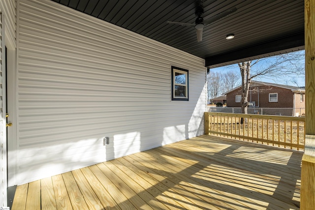 wooden terrace featuring ceiling fan