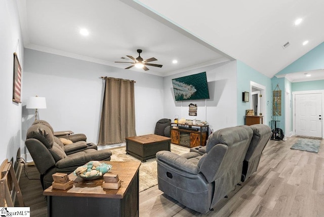 living room featuring ceiling fan, lofted ceiling, ornamental molding, and light hardwood / wood-style flooring