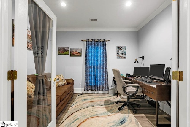 home office featuring hardwood / wood-style flooring, ornamental molding, and french doors