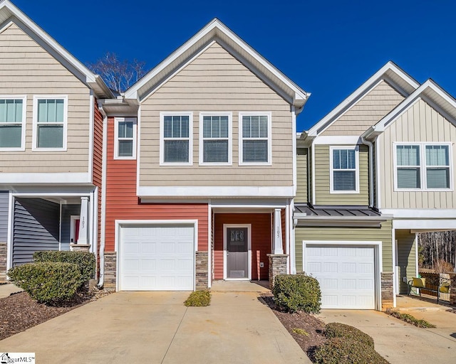 townhome / multi-family property featuring a garage