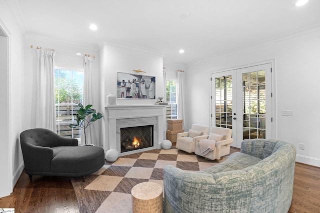 living room featuring a wealth of natural light and crown molding