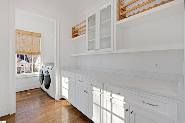 laundry room featuring dark hardwood / wood-style flooring and independent washer and dryer