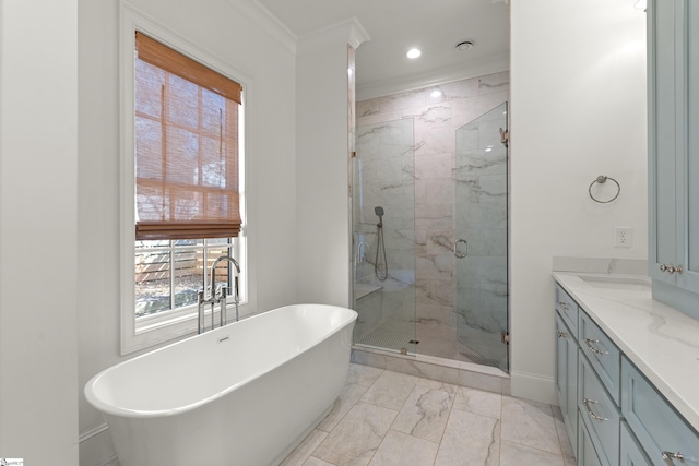 bathroom with vanity, ornamental molding, and shower with separate bathtub