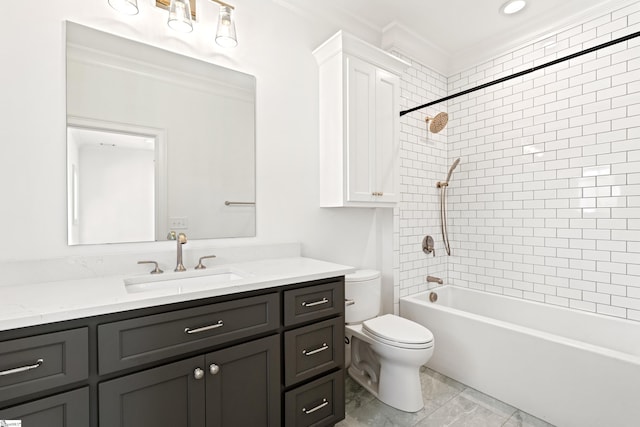 full bathroom with toilet, vanity, ornamental molding, and tiled shower / bath