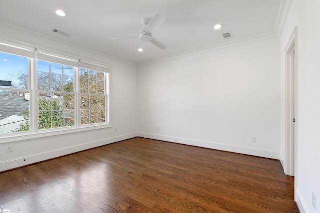 unfurnished room featuring dark wood-type flooring, crown molding, and ceiling fan