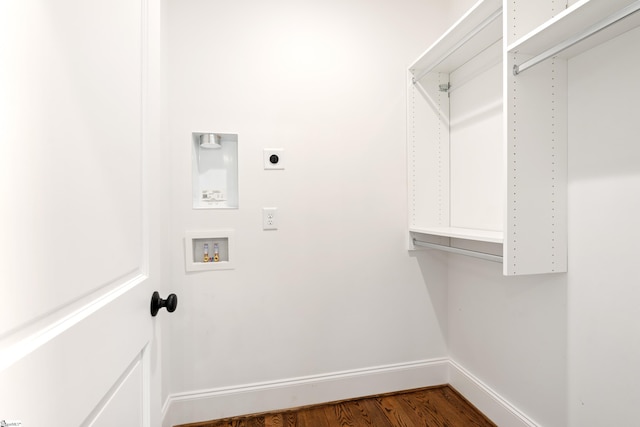 clothes washing area featuring dark hardwood / wood-style floors, hookup for a washing machine, and hookup for an electric dryer