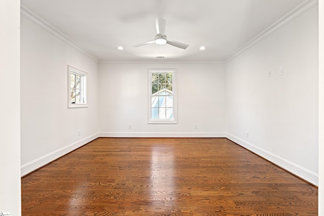 spare room featuring ceiling fan, dark hardwood / wood-style floors, and crown molding