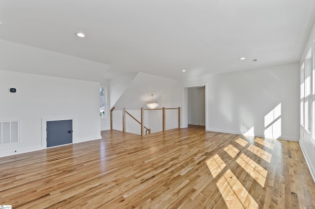 unfurnished living room featuring light hardwood / wood-style floors
