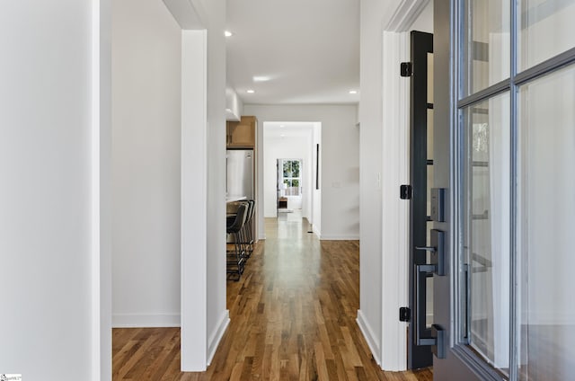 hallway featuring hardwood / wood-style flooring