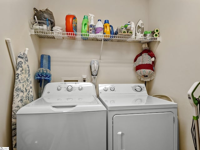 clothes washing area featuring washing machine and clothes dryer