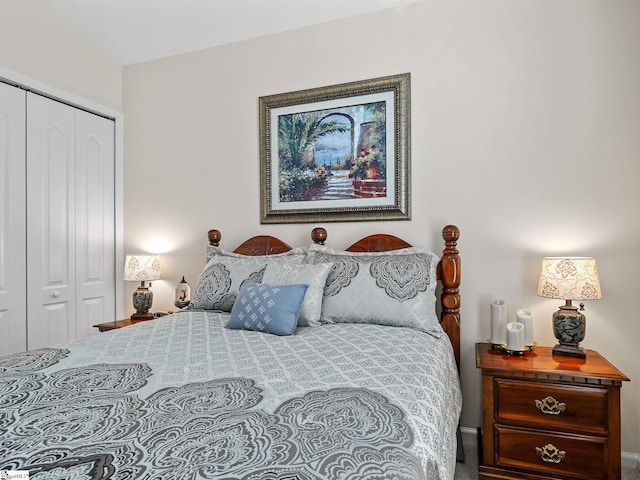 bedroom with a closet and vaulted ceiling