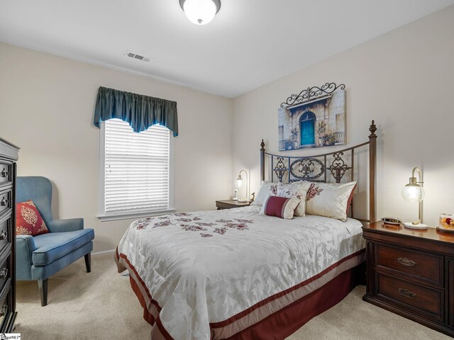 bedroom with light colored carpet