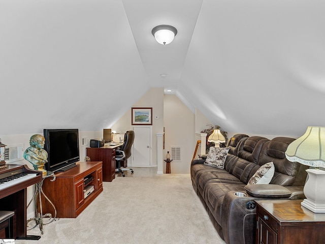 office space featuring light colored carpet and lofted ceiling