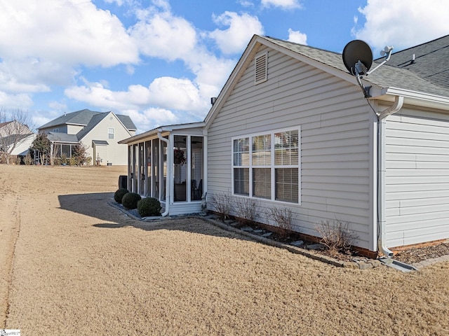 back of house with a sunroom