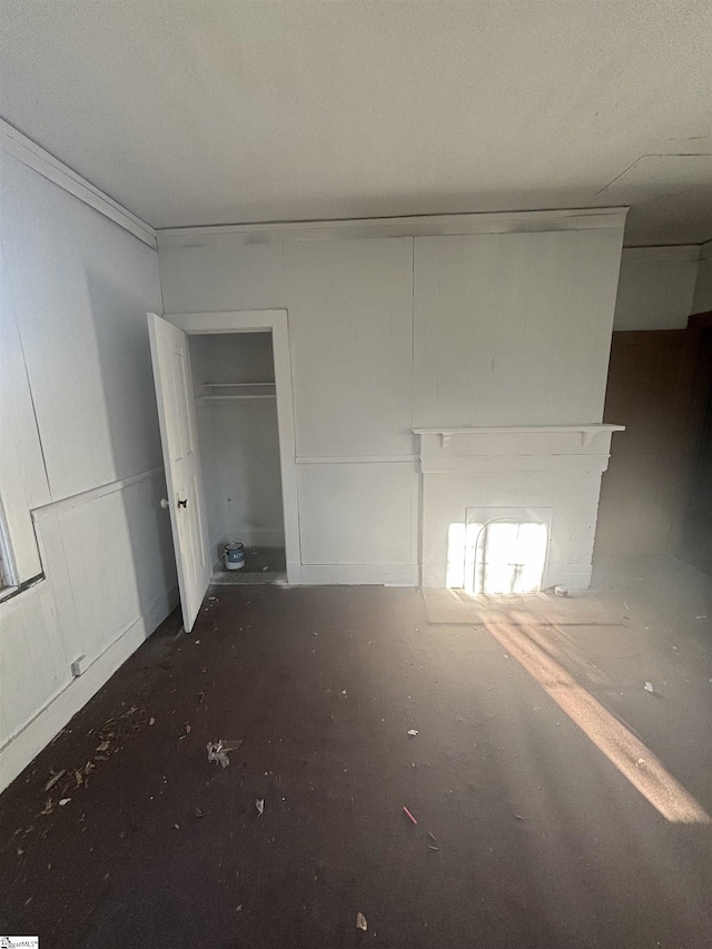 spare room with a fireplace