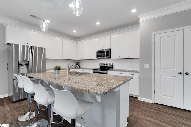 kitchen with sink, white cabinetry, and stainless steel appliances