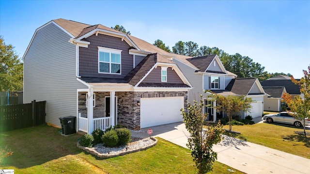 craftsman-style house with a front yard and a garage