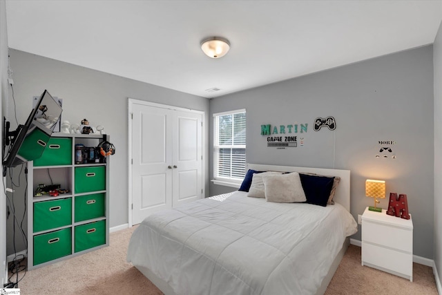 carpeted bedroom with a closet